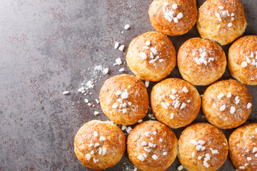 Authentic English for tea bath buns with cumin and sugar close-up on the table. Horizontal top view...