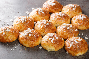 Homemade sweet hot bath bun with cumin and sugar close-up on the table. Horizontal