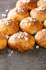 English bath buns roll with cumin and sugar close-up on the table. Vertical