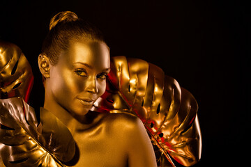 Photo of brilliant elegant sculpture lady stand studio flower covered gleam metallic isolated dark color background