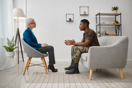Military male patient sitting front of psychologist