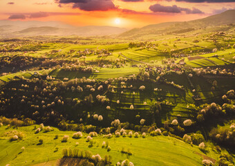 Spring landscape in Slovakia. Polana region, Hrinova. Green spring rural hills landscape, fields, flowering trees, organic farming © Zedspider