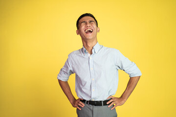 portrait of asian businessman laughing naturally over isolated background