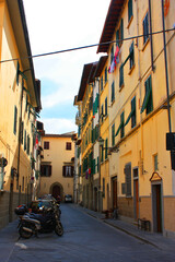 Typical historical old narrow street in Florence, Italy