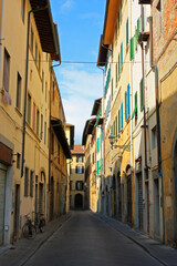 Fototapeta na wymiar Typical historical old narrow street in the city of Florence