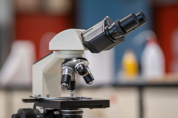 Fototapeta na wymiar Close up of white microscope into laboratory.