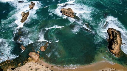 white caps and sea waves on the rocks