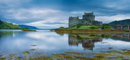 Panorama of Eileen Donan castle in Scotland on a tranquil early morning with reflections