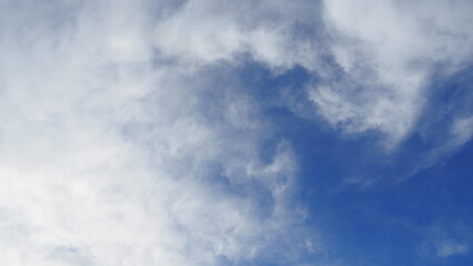 background of blue sky with clouds in clear weather