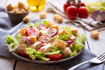 Delicious vegetable salad with lettuce, tomatoes and chicken