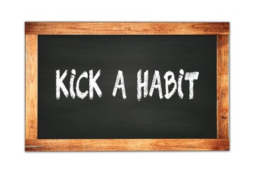 KICK  A  HABIT text written on wooden frame school blackboard.