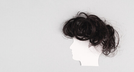 Silhouette of a face with a hairstyle, woman, man, transgender, copy space for text, portrait with...