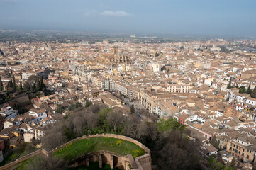 Fototapeta na wymiar Aerial panoramic view on buildings, old district, mountains and palace, world heritage city Granada, Andalusia, Spain