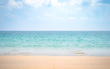 Minimal Sand Sea Sky on the Kata beach at Phuket Island, Thailand, Shoot by Tele Lens zoom in to little wave on it with blur blue sky and cloud.
