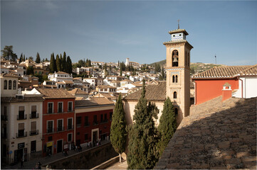 Fototapeta na wymiar View from roof on buildings in old central part of world heritage city Granada, Andalusia, Spain