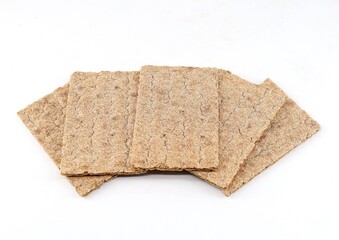 Crispy slices of wholemeal rye bread on a white background. 