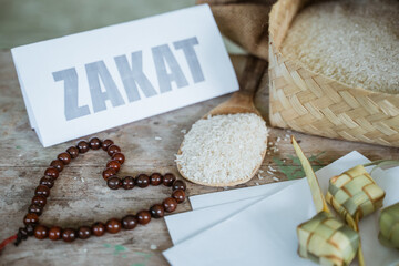 zakat with money and rice. Muslim concept for zakat payment on the table