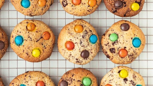 Shortbread cookies with multi-colored chocolate droplets on the white background