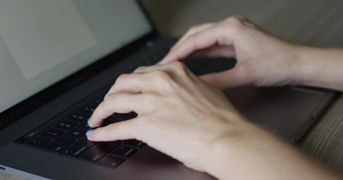 Hands Of A Woman Typing On Laptop Keyboard Static
