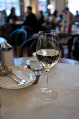Glass of white dry Austrian wine served in cafe in Vienna, Austria