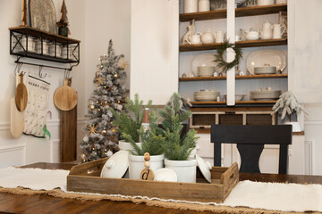 Christmas table decor in farmhouse dining room - obrazy, fototapety, plakaty