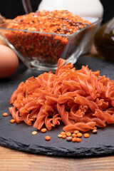 Vegan gluten free and vegetarian food, dried spiral pasta made from orange lentils legumes