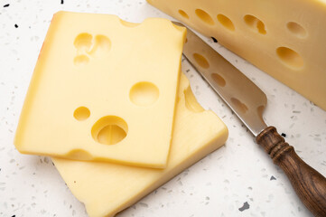 Swiss cheese collection, yellow emmentaler cheese with round holes