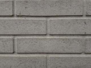 Fragment of stone brick wall in gray color