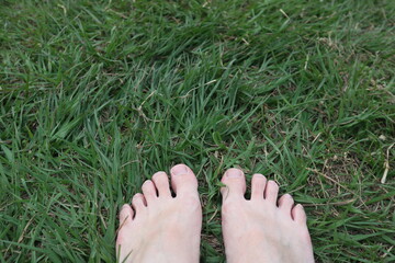 barefoot on the grass design for leisure time and relaxation concept