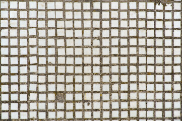 Old urban wall white ceramic tiles close-up background
