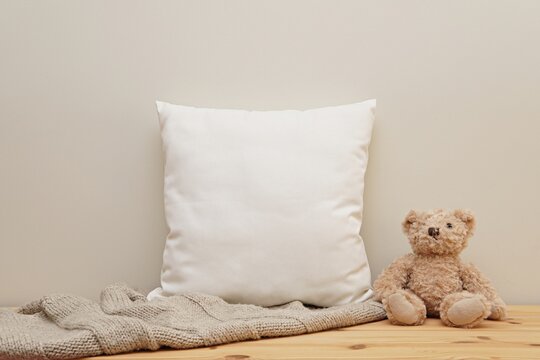 White square cotton pillow case mockup, neutral baby or kids canvas cushion mock up in nursery interior.