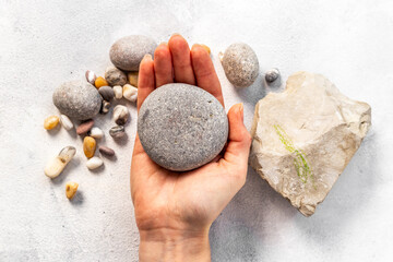 Natural crystal mineral stone in hands. Crystal texture closeup