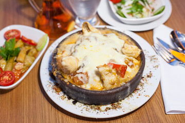 served in traditional casserole pot