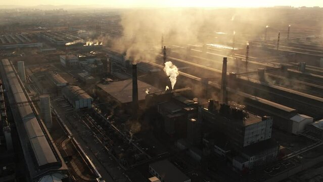 View of a large aluminum production plant, aerial shot at sunset
