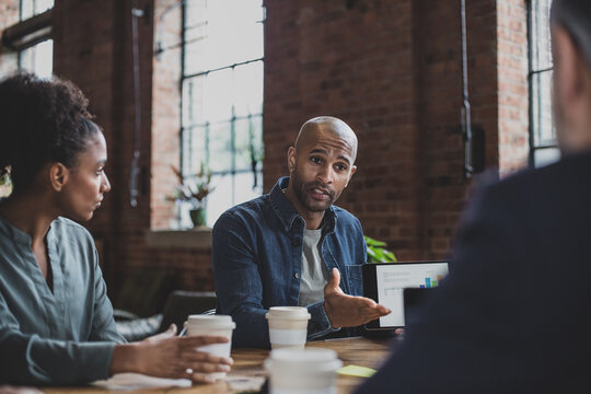 African American businessman presenting to clients