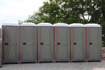 cabins with outdoor chemical toilets available for people to go to the toilet