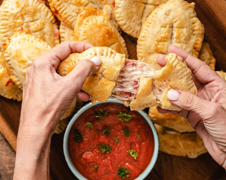 Football Shaped Crescent Roll Pizza With Sauce.