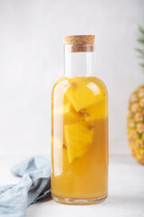 Bottle of tepache, a fermented drink of pineapples and sugar, spices