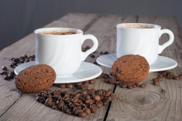 Fresh coffee with biscuits and roasted beans