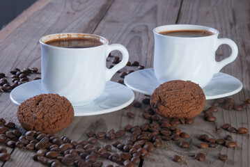 Fresh coffee with biscuits and roasted beans