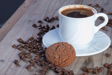 Fresh coffee with biscuits and roasted beans