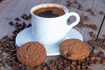 Fresh coffee with biscuits and roasted beans
