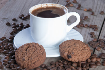 Fresh coffee with biscuits and roasted beans
