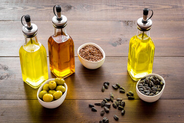 Vegetarian cooking oil in bottles. Sunflower olive and sesame oil with ingredients