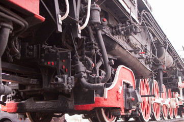 Russia, Tyumen, City Park: Elements of a vintage steam locomotive