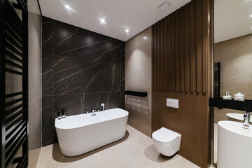 New, modern bathroom with wood and black wall