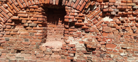 old red brick wall made with different masonry
