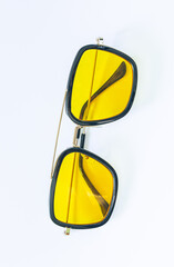 Yellow fashion glasses on a white background,Circle yellow vintage glasses isolated on white background,Pair of modern, stylish sunglasses isolated on white 