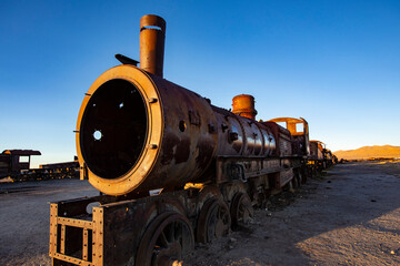 Train Cemetery in Uyuni, Old rusty trains, railway museum at sunset lights, Uyuni, Bolivia