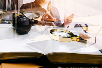 Justice and Law concept. Legal counsel presents to the client a signed contract with gavel and...